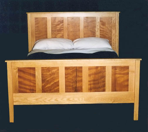 Boston bed in oak with curly Redwood panels